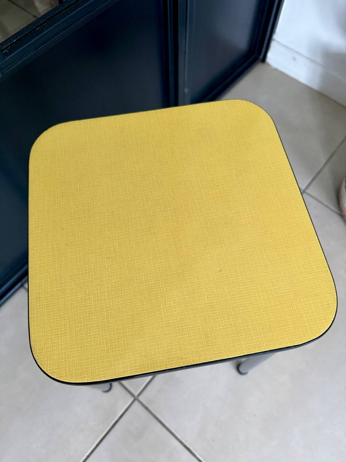 Yellow Formica stool