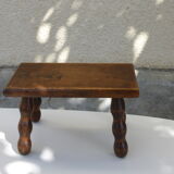 Old wooden stool, worked, turned foot, handcrafted