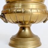 Vintage brass cache-pot on a stand with handles, classic decor.