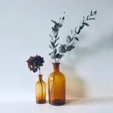 Duo of ancient apothecary flakes in amber glass