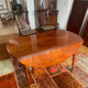Solid mahogany dining table from the Louis XVI period, extendable.