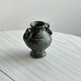 Green face vase.