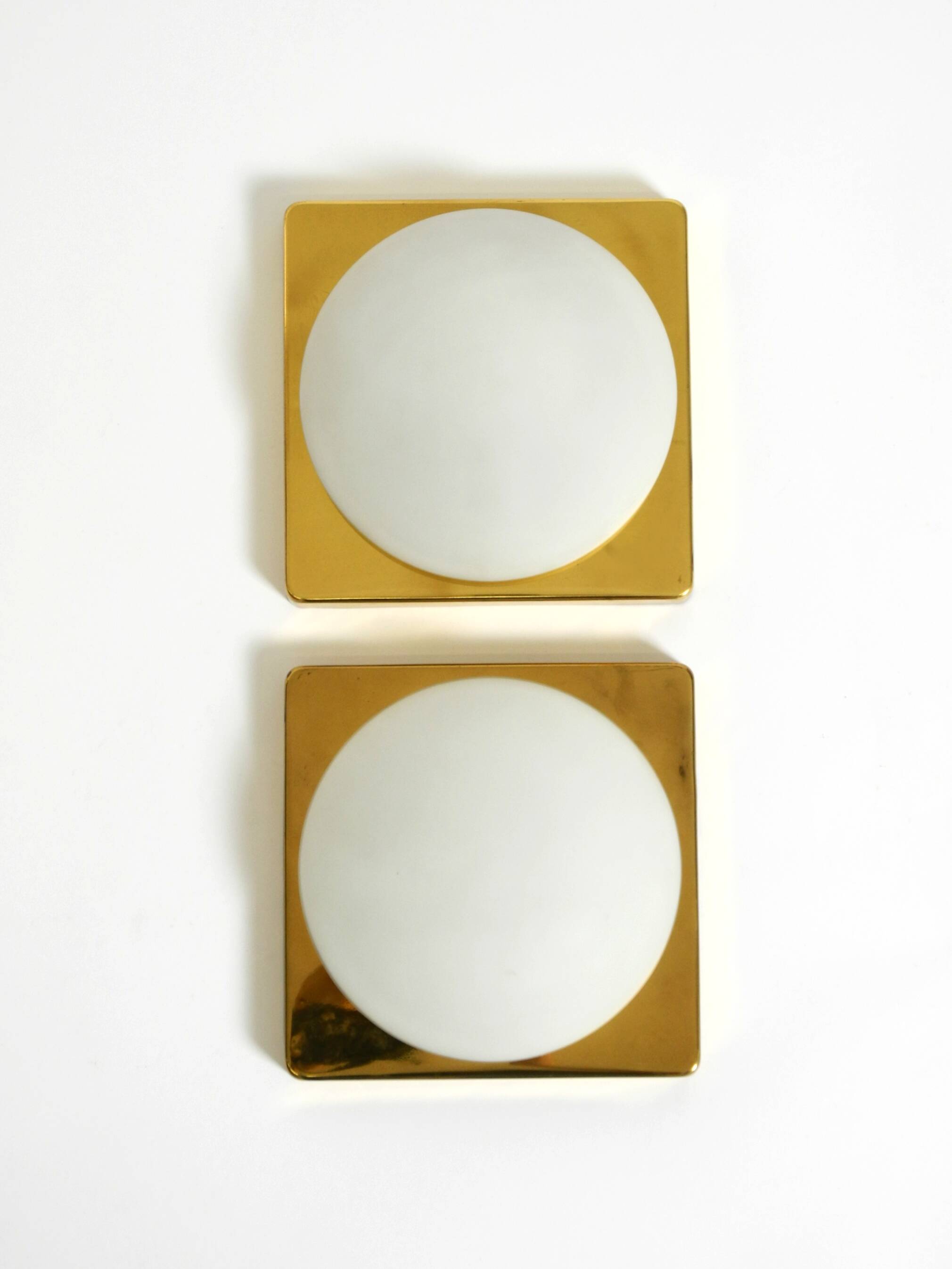 Two 1970s brass wall lamps by Rolf Krüger for Heinz Neuhaus Leuchten