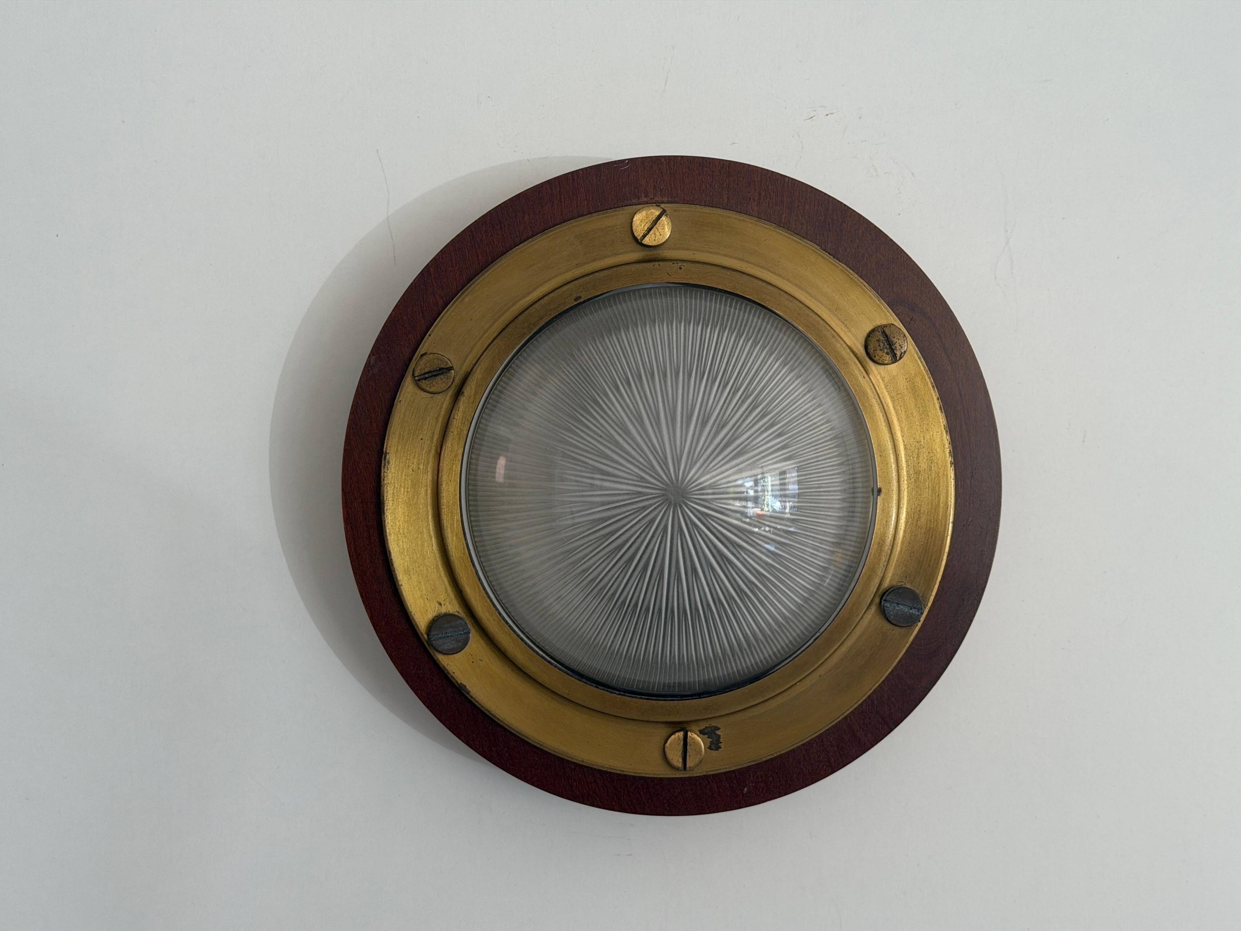 Pair of round glass wall lights, brass base and Wood Wood, 1960s, Italy.