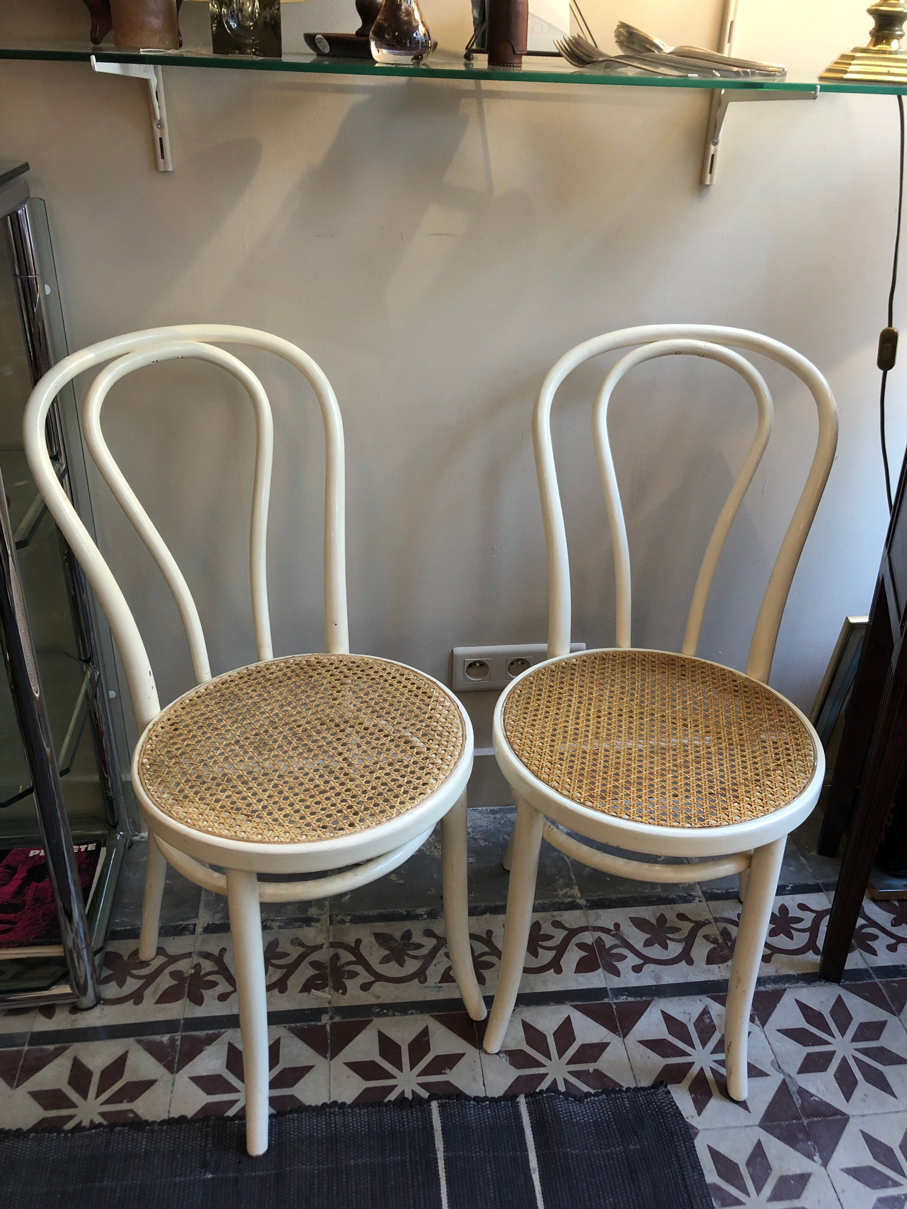 Couple of white bistro chairs