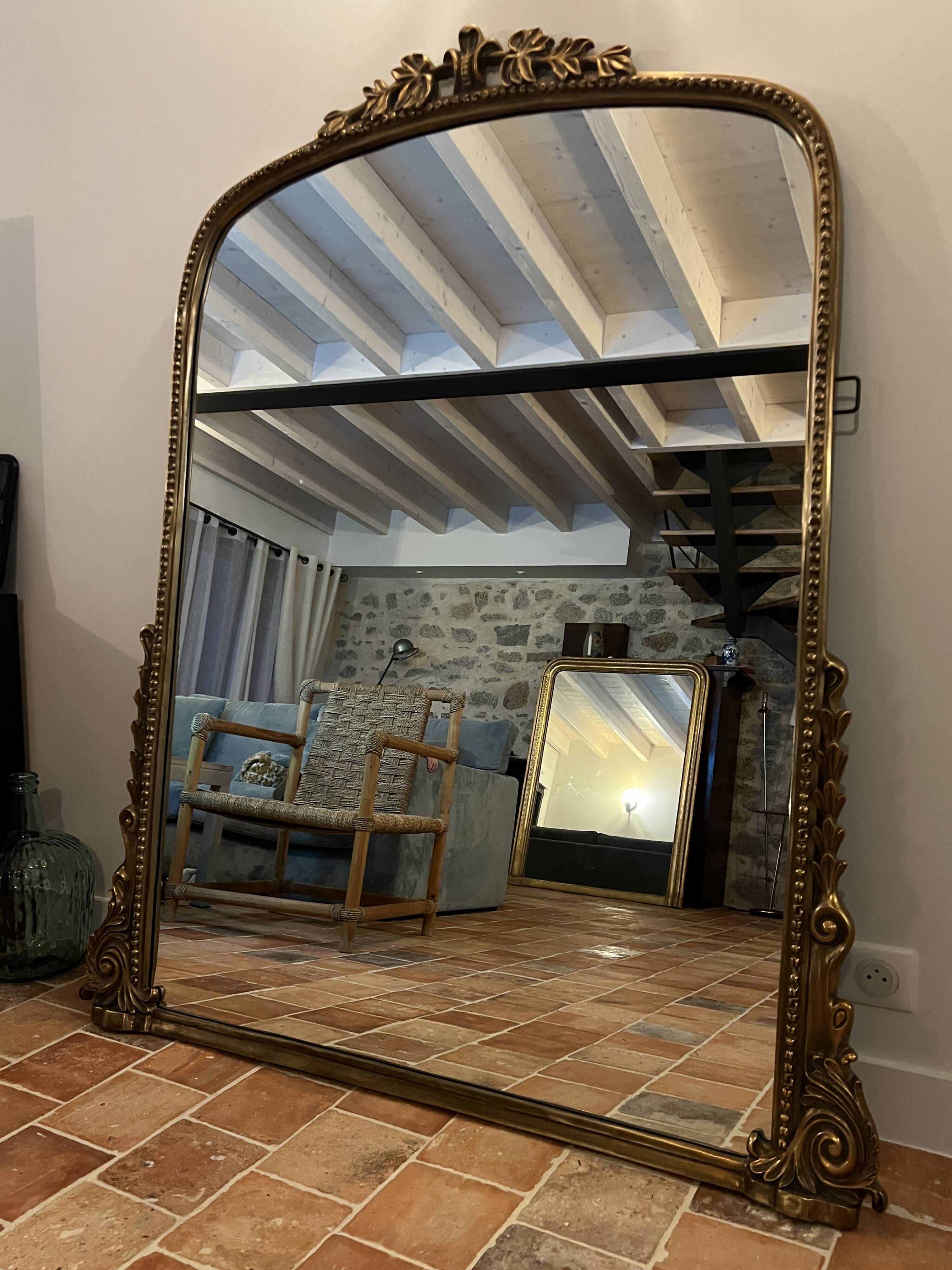 Large gilded mirror with pediment