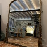 Large gilded mirror with pediment