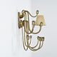 Wall sconce with nine arms in brass, France, circa 1950.