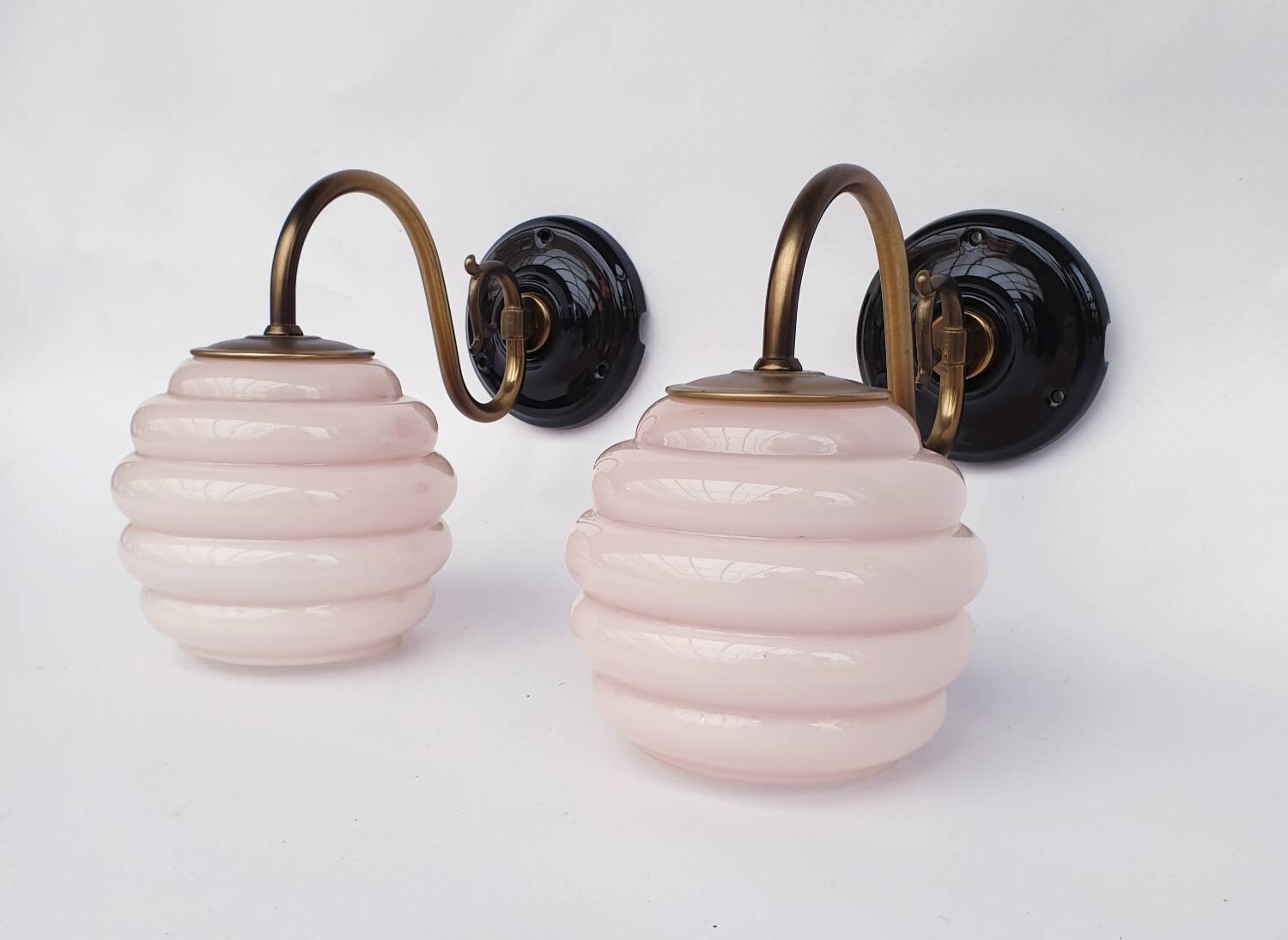 Brass and glass swan neck wall lights