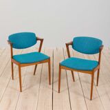 Pair of 42 Kai Kristiansen teak chairs in original blue bouclé upholstery, Denmark, 60s.