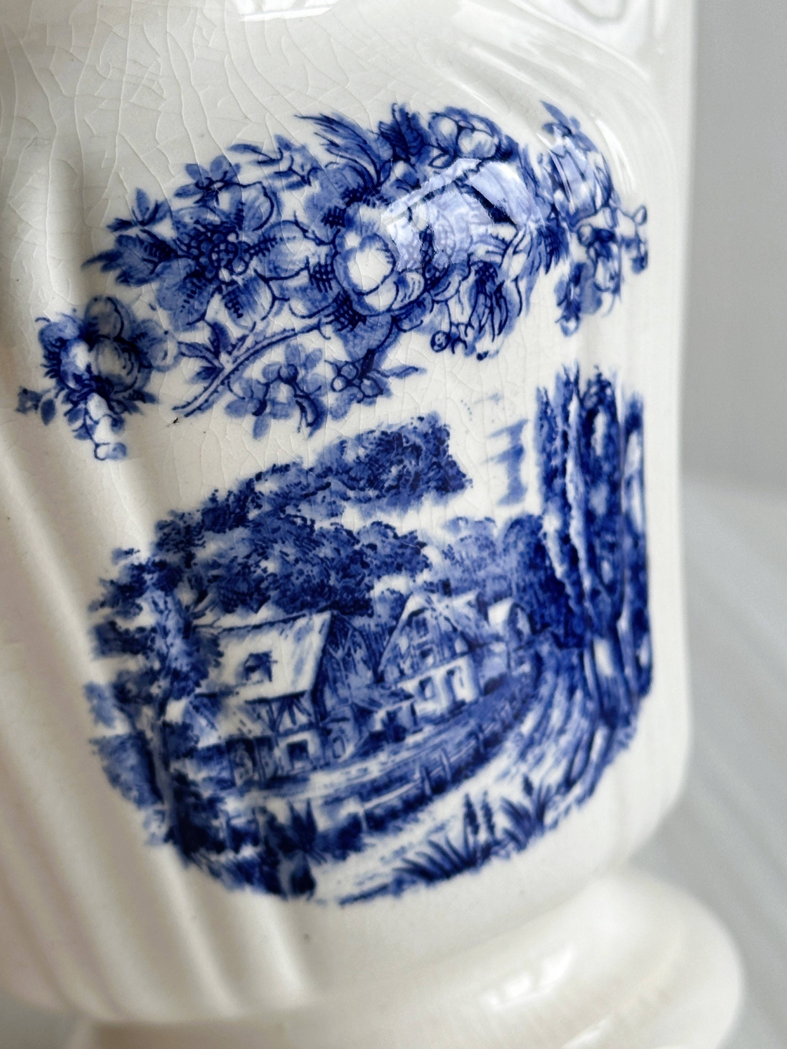 Porcelain sauce boat with blue pastoral pattern