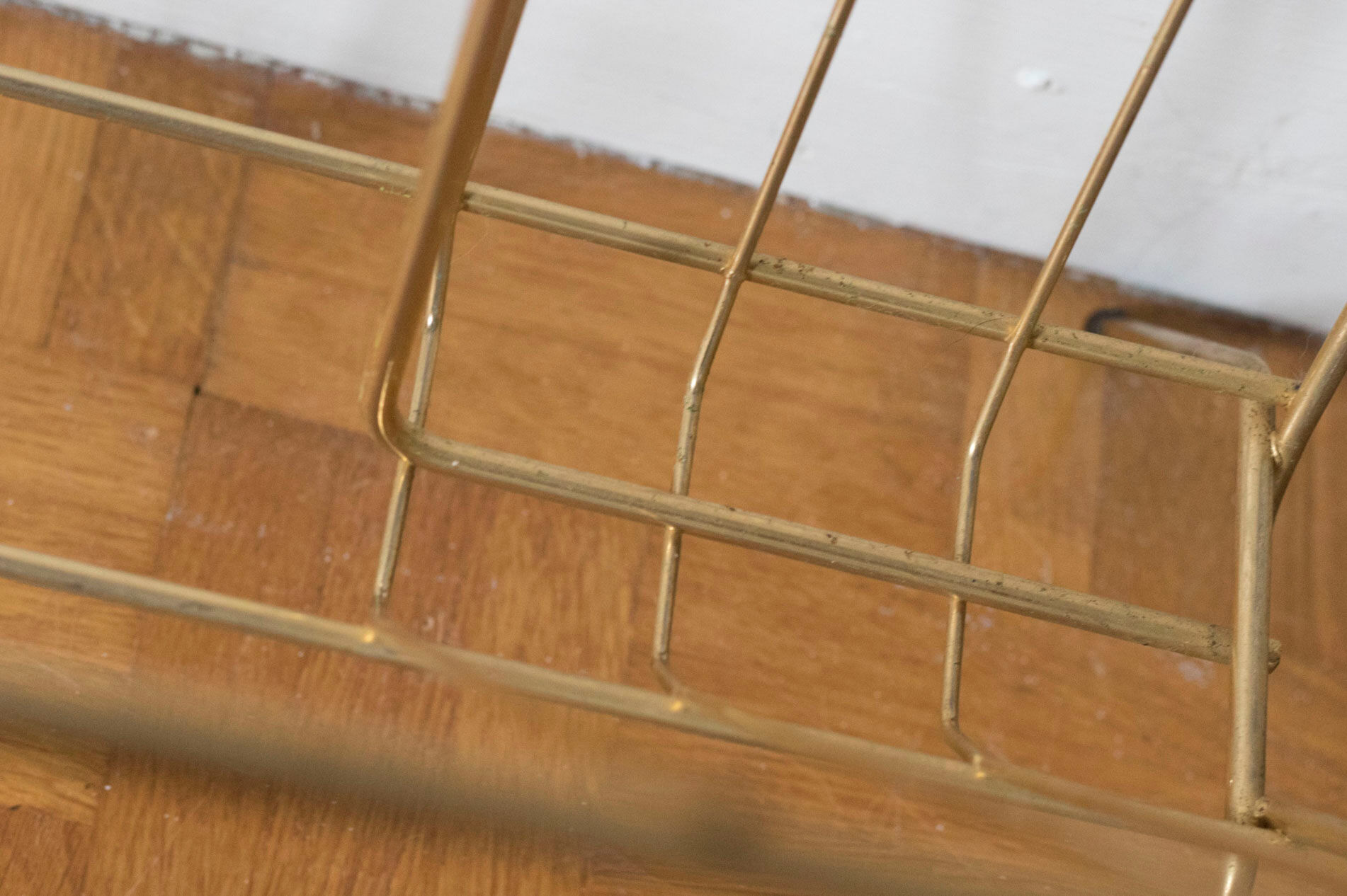 Vintage magazine holder in gold metal