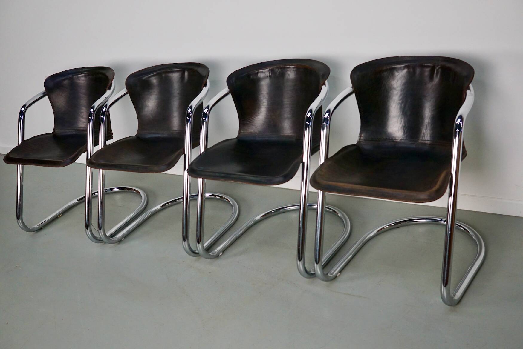 Set of four brown leather dining chairs, Willy Rizzo, 1970