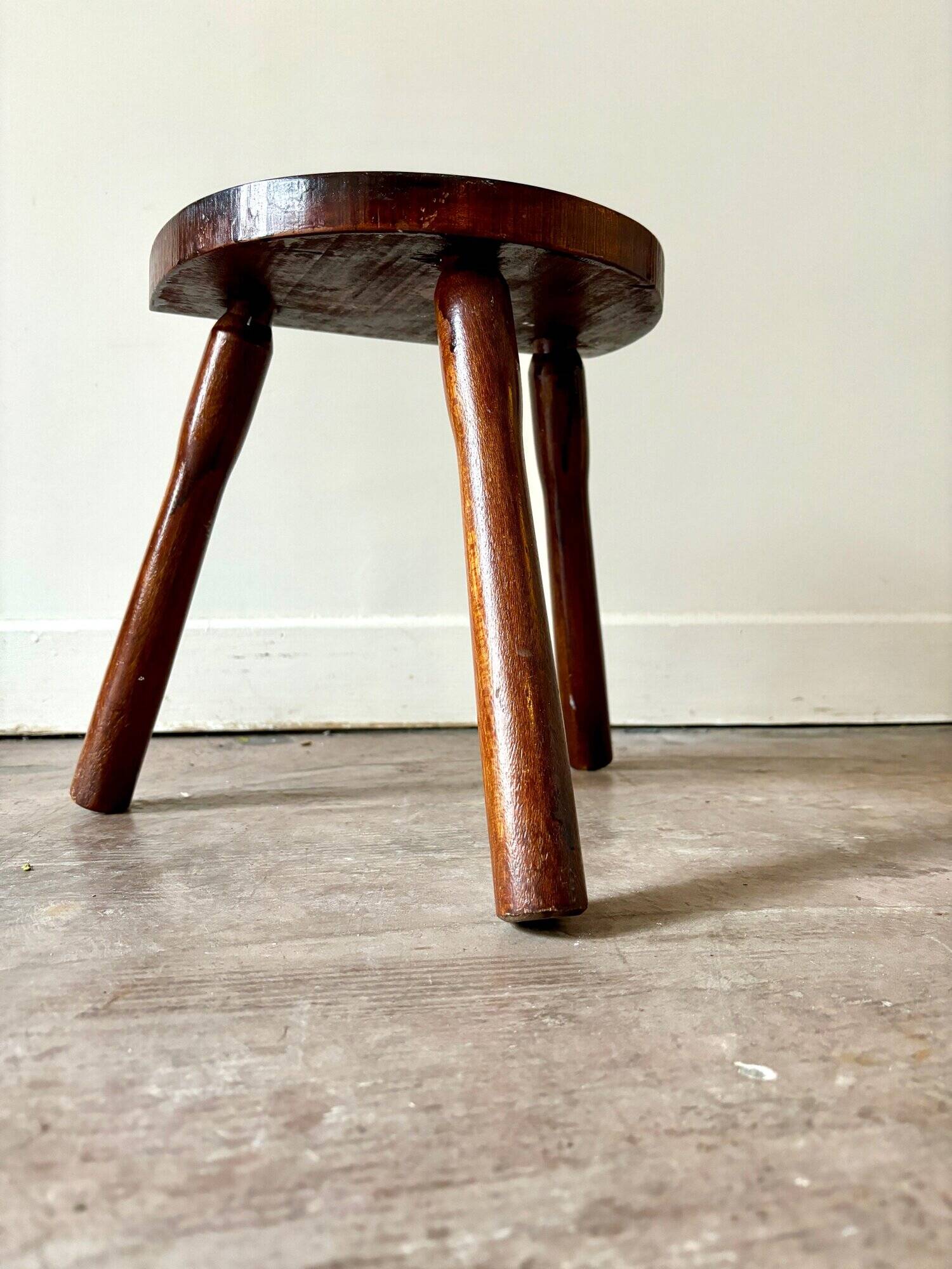 Dark wood tripod stool