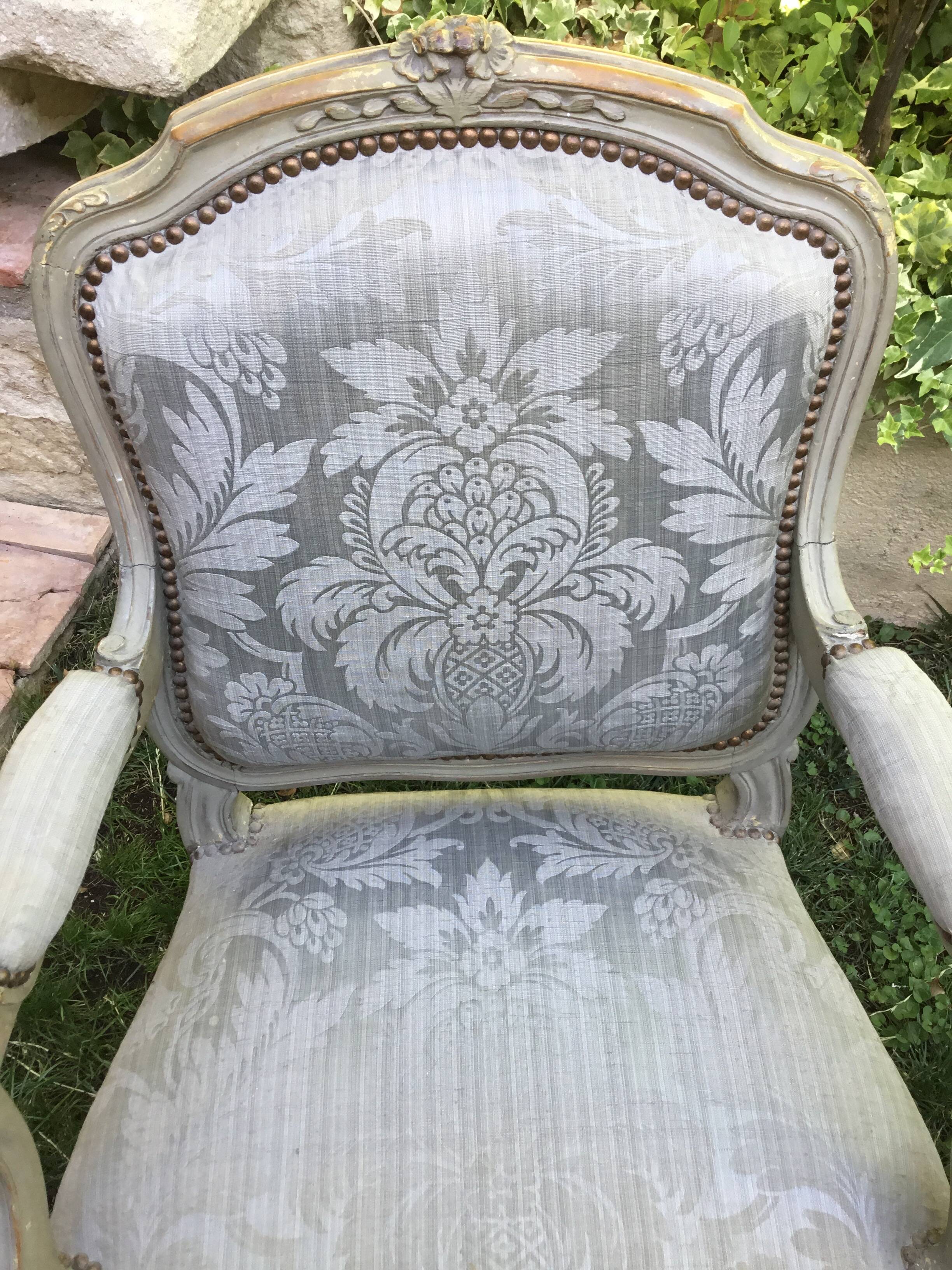 Pair of Louis XV style armchairs in grey lacquered wood.