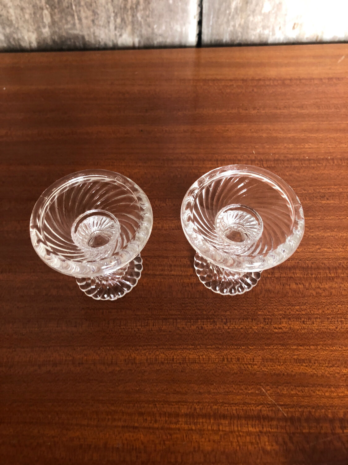 Old pair of vintage round molded glass candle holder