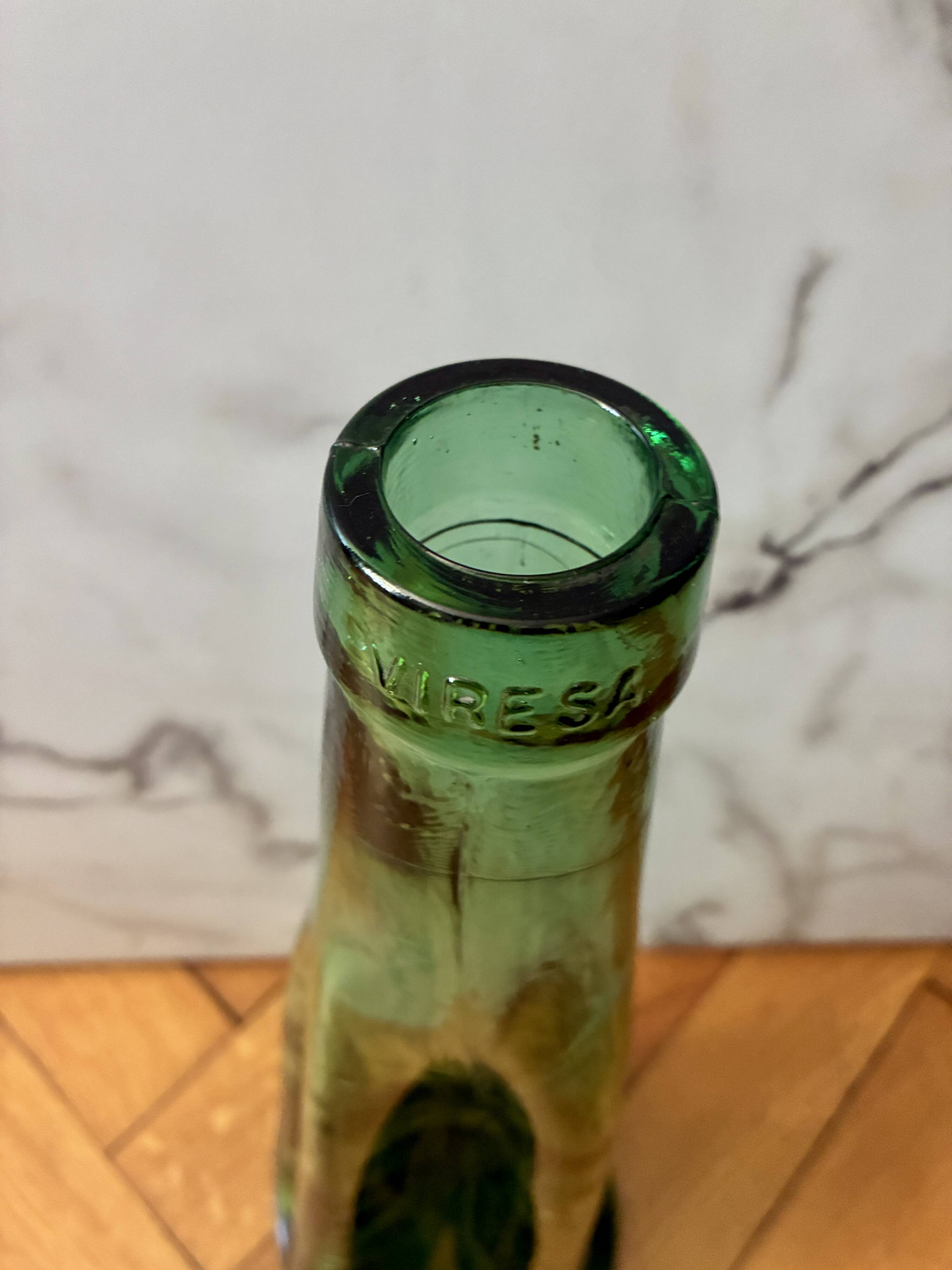 Vintage Viresa bottle in a flattened shape.