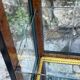Pair of display cases in magnifying glass and black & gold lacquer, 20th century period