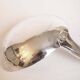 Silver plated metal service: 12 soup spoons, 12 forks and ladle.