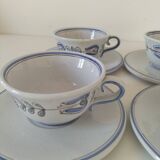 Glazed earthenware cups and saucers