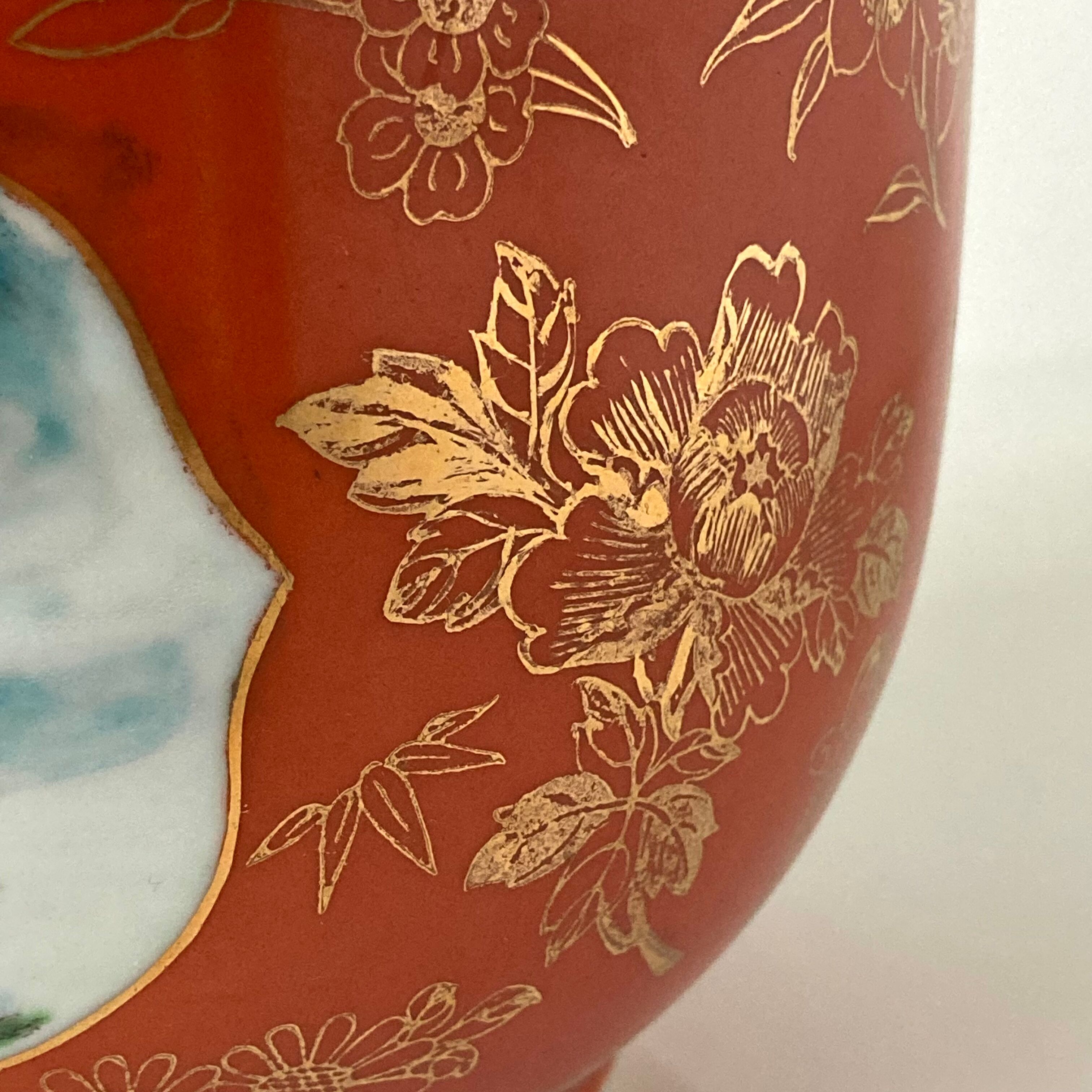 Chinese planter or Chinese porcelain pot cover decorated with landscapes on a coral and golden background