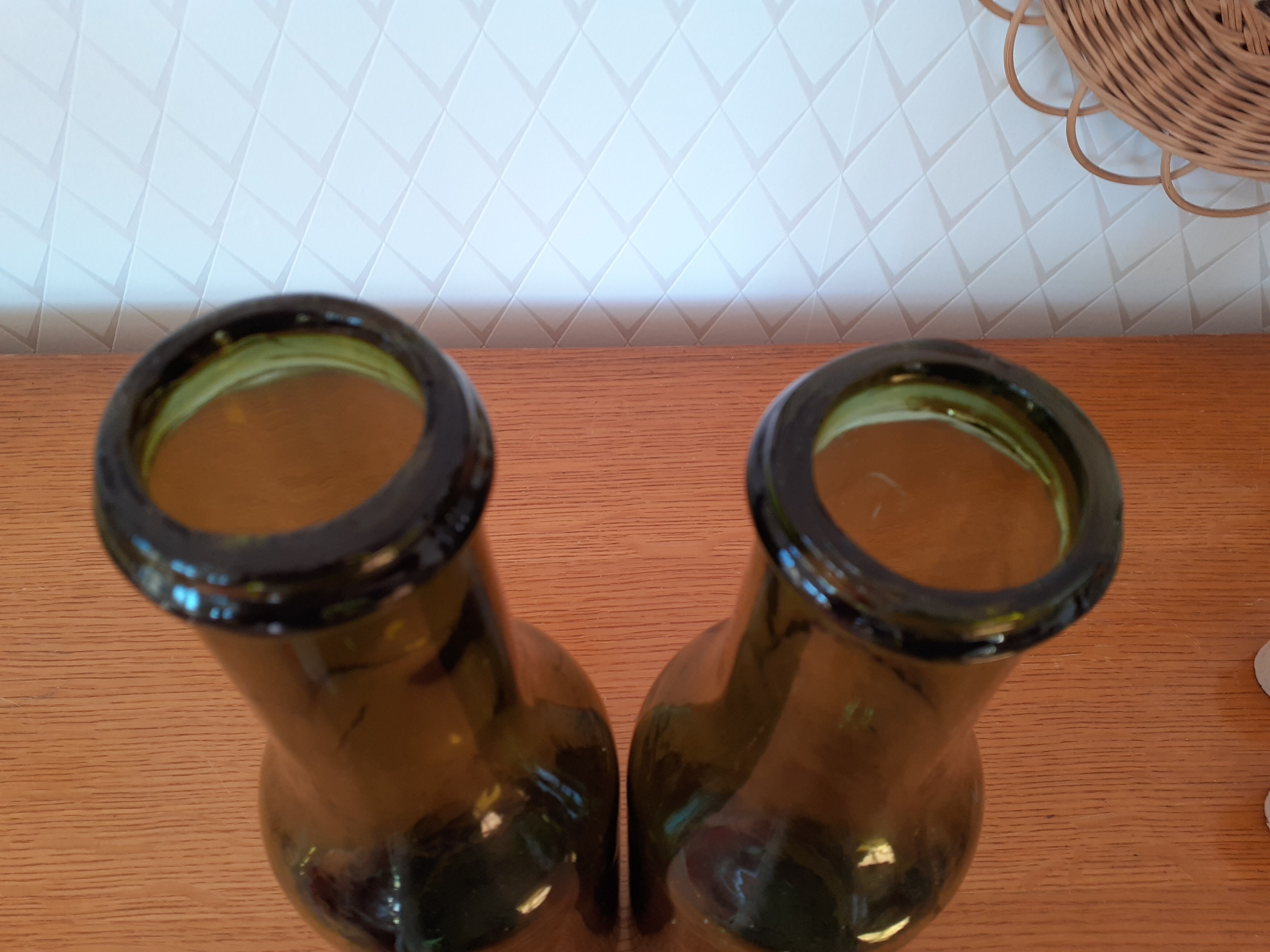 Pair of green bottles made of bubbled blown glass