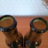 Pair of green bottles made of bubbled blown glass
