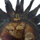 Large brutalist sun mirror in patinated metal with gold accents, 1970.