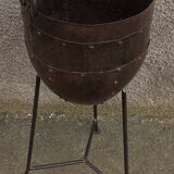 Old metal pot on foot