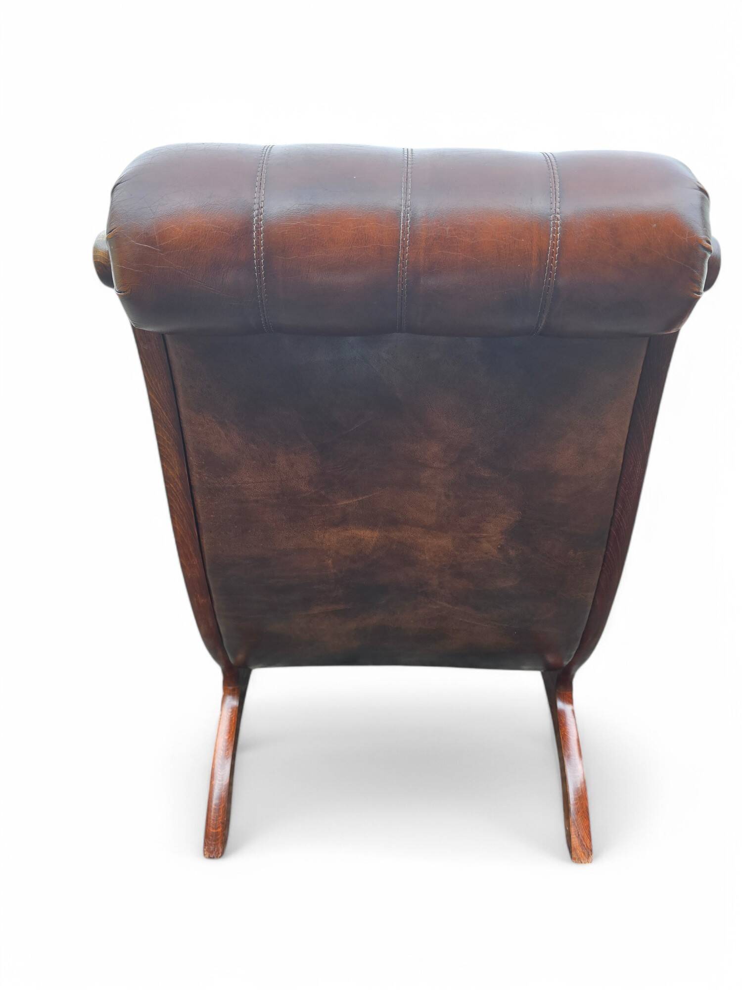 Pair of leather Chesterfields and footstools