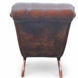 Pair of leather Chesterfields and footstools