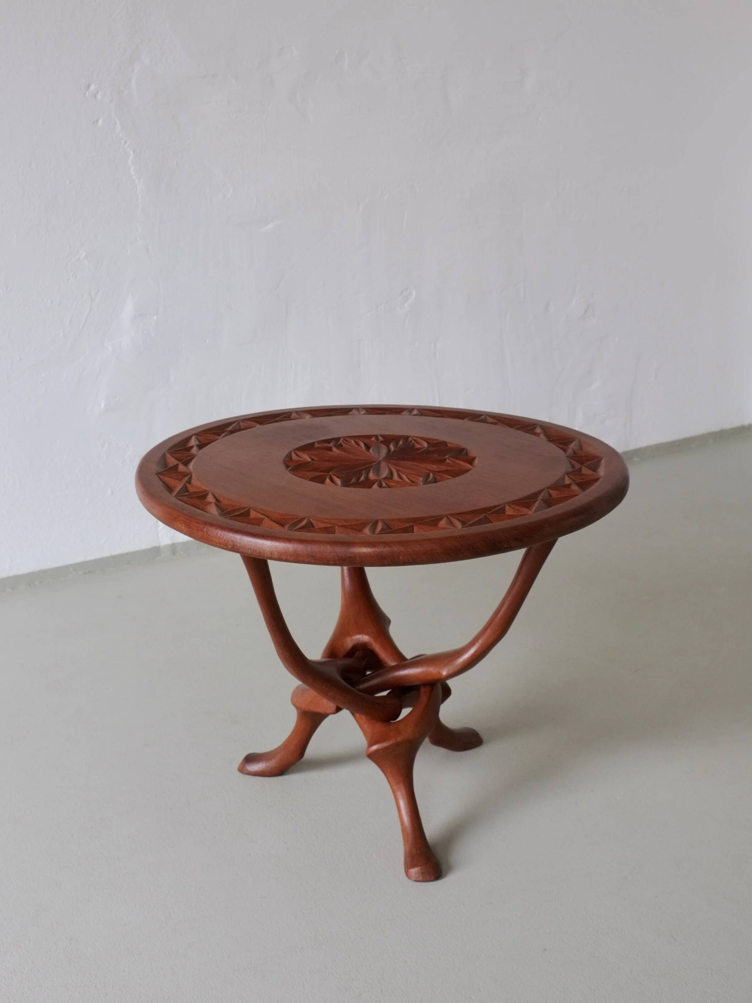 Sculptural carved teak side table | 1960s