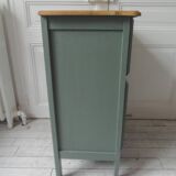 Meuble vintage en vert fumé, plateau bois.