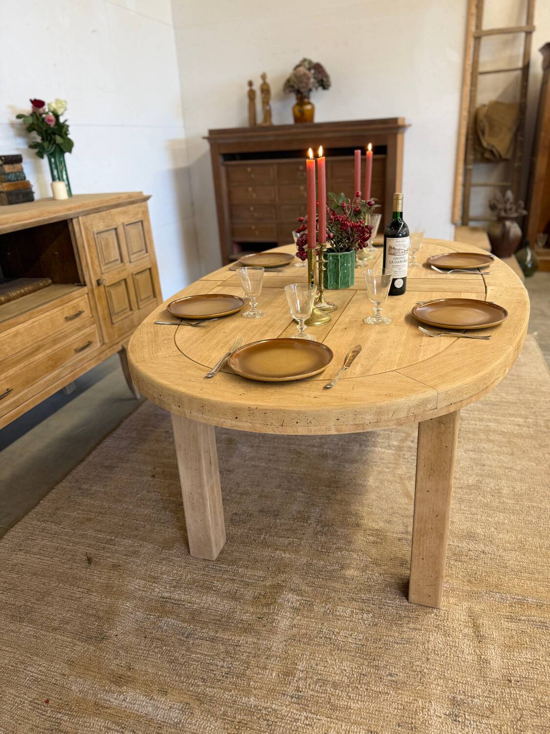 Oval farmhouse table in solid oak with extensions.