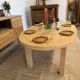 Oval farmhouse table in solid oak with extensions.