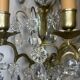 19th-century wall sconce, bronze and crystal pendants.