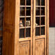 Antique glass-fronted cabinet in raw solid oak: display cabinet bookshelf.