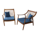 Pair of cozy teak armchairs with cushions