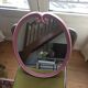 Vintage pink oval cast iron mirror