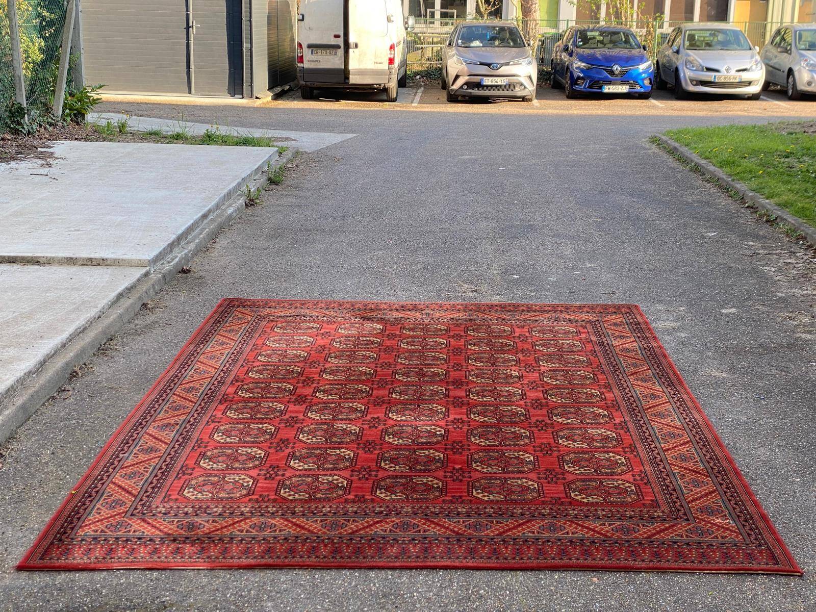 Tapis persan en laine rouge bordeaux Louis de Poortere 250x350cm