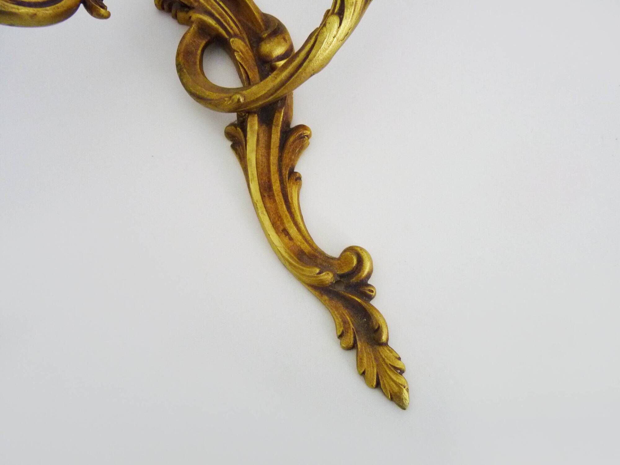 Antique pair of double-light bronze wall sconces with acanthus leaves. 1950s