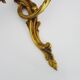 Antique pair of double-light bronze wall sconces with acanthus leaves. 1950s