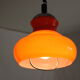 Suspension goes up and down from the kitchen, orange blown glass.