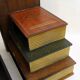 Pair of bookends (& secret boxes) in trompe l'oeil Stacked books