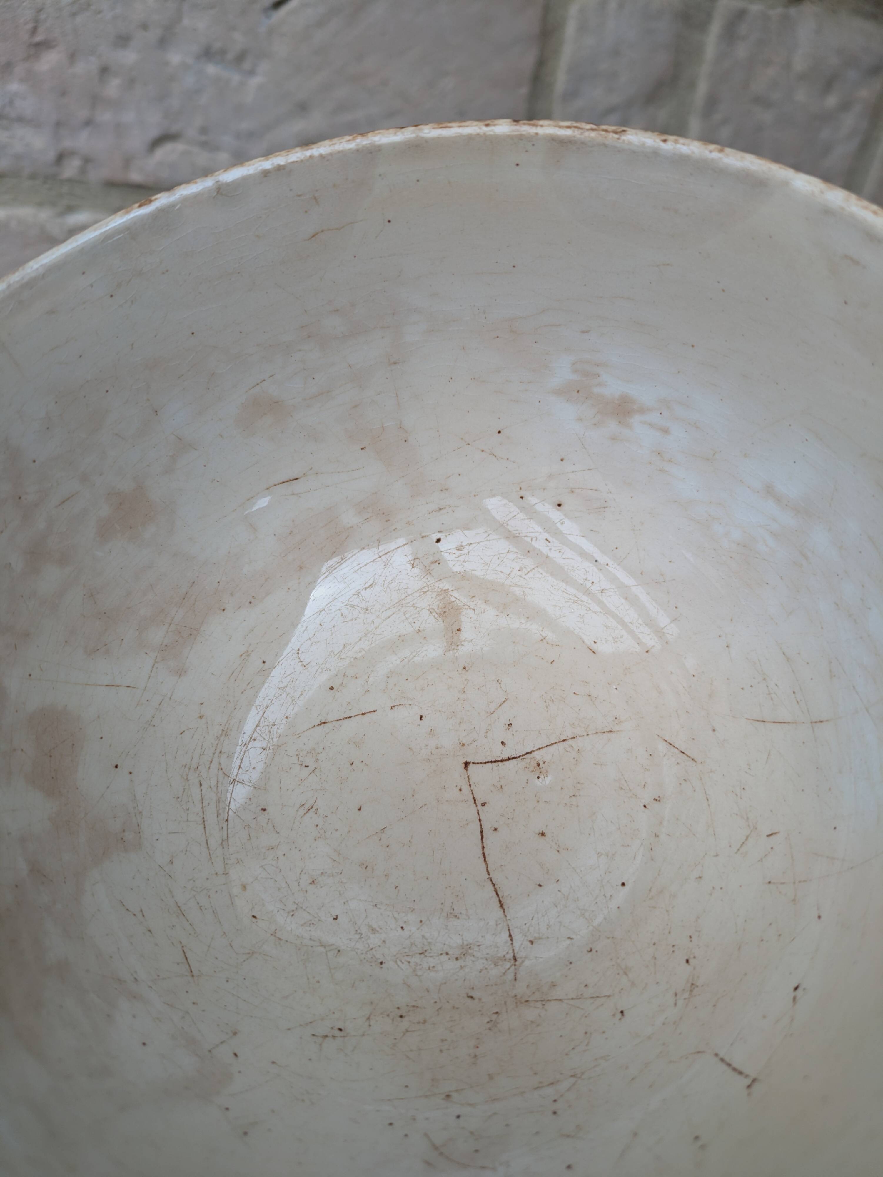 Old opaque porcelain bowl from Gien with a floral decoration.