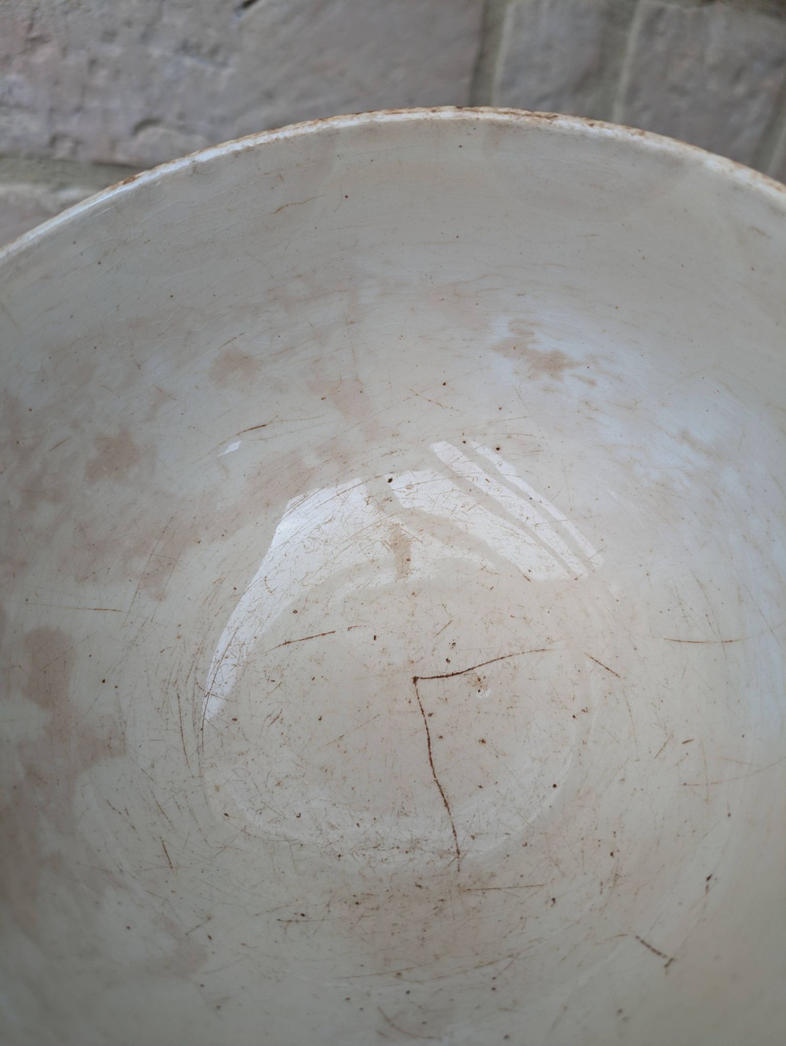 Old opaque porcelain bowl from Gien with a floral decoration.