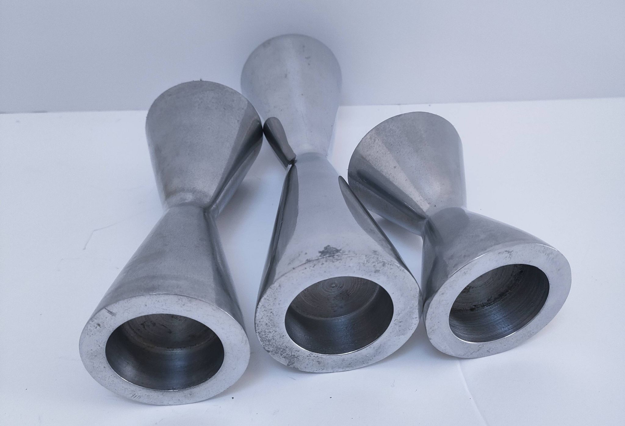 three "diabolo" aluminium design candle holders 90