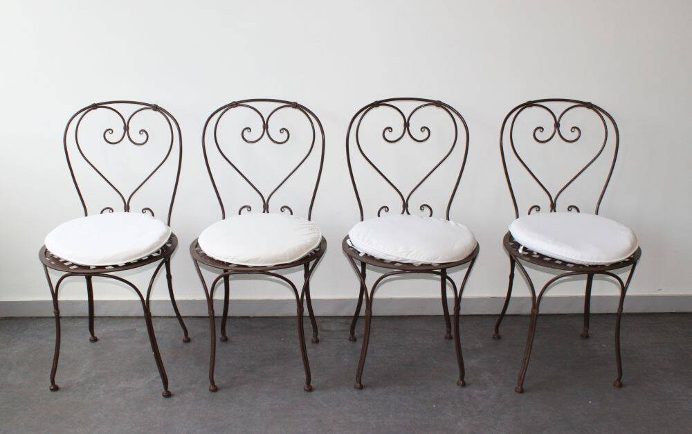 Set of 4 wrought iron chairs.