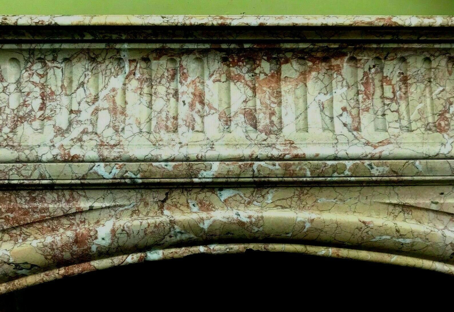 Louis XIV-style fireplace has 19th century veined pink marble hood