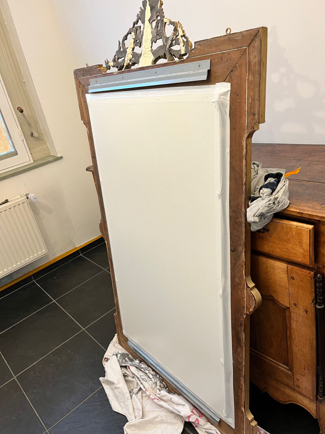 Antique Louis XVI style mirror in gilded wood